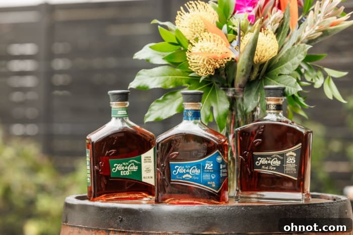 Flor de Caña rum bottles displayed on a table with cocktail-making ingredients.