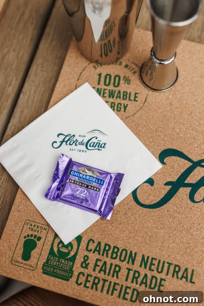 A small square of rich dark chocolate, perfectly paired with a drink.