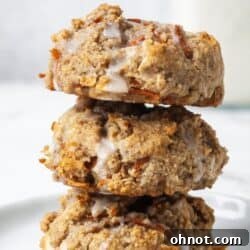 A stack of Paleo carrot cake cookies with coconut butter glaze.