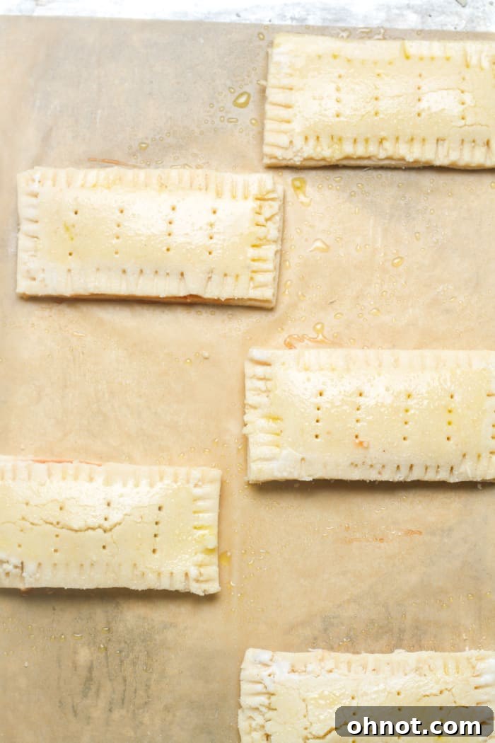Pop tart dough with crimped edges and fork holes on top.
