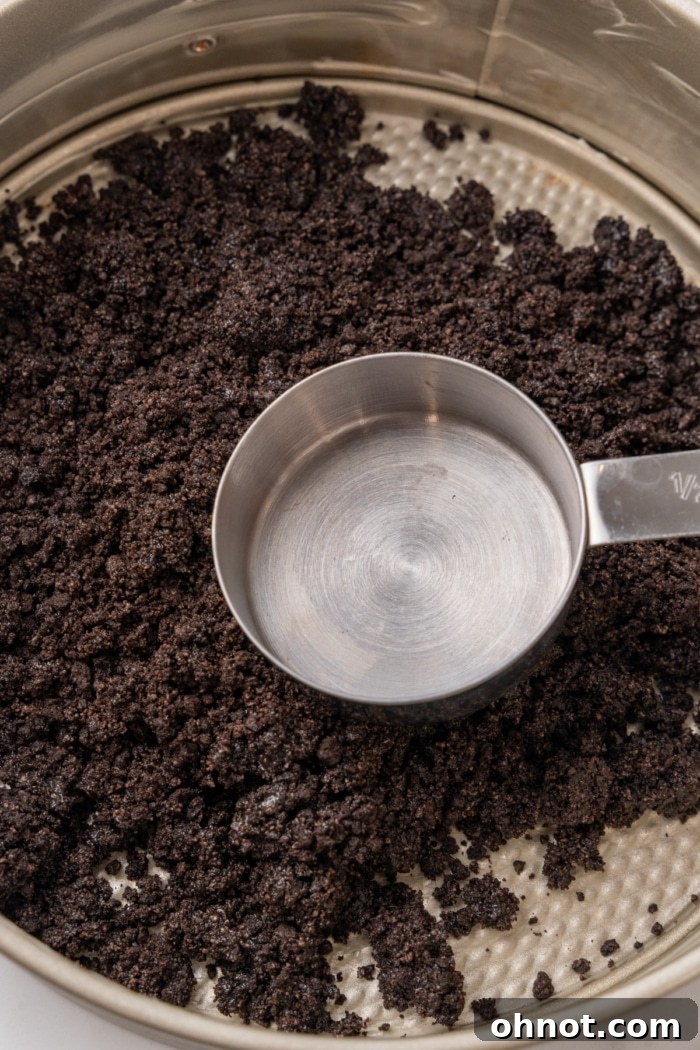 Measuring cup and Oreo crumbles.