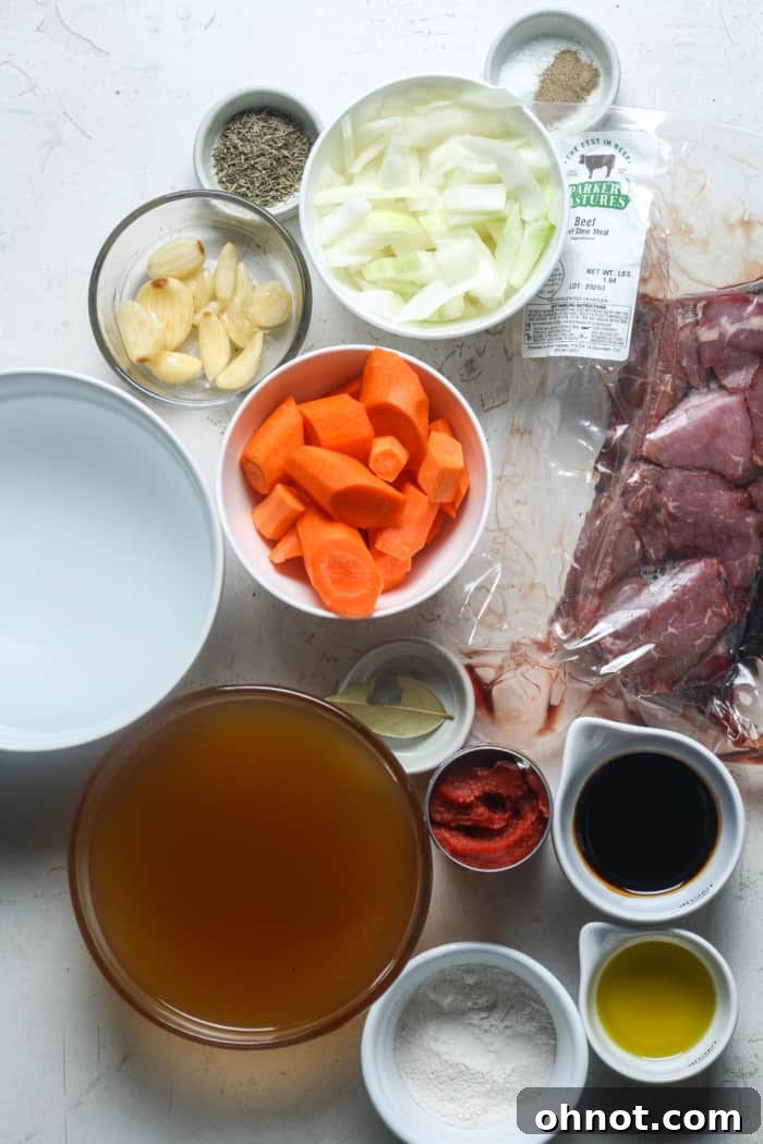 Fresh ingredients for Dutch oven beef stew arranged on a cutting board.