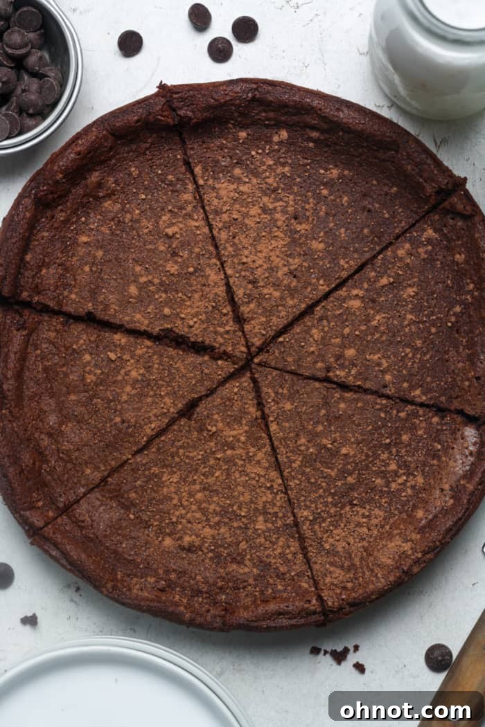 Elegant slices of flourless chocolate torte on a serving platter.