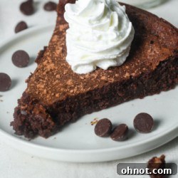 Flourless chocolate torte, sliced and ready to serve.