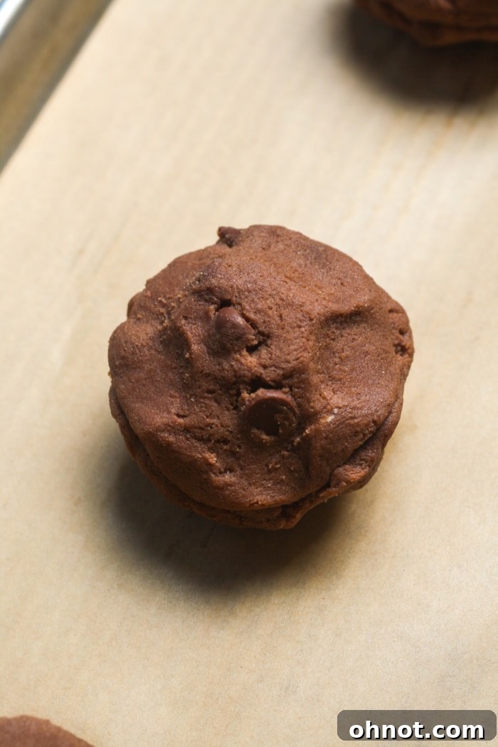 Perfectly shaped, stuffed double chocolate cookie ready for baking.