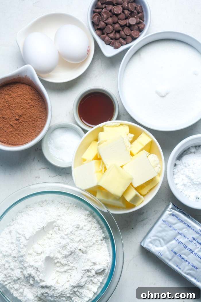 Assortment of fresh ingredients for baking chocolate cheesecake cookies.