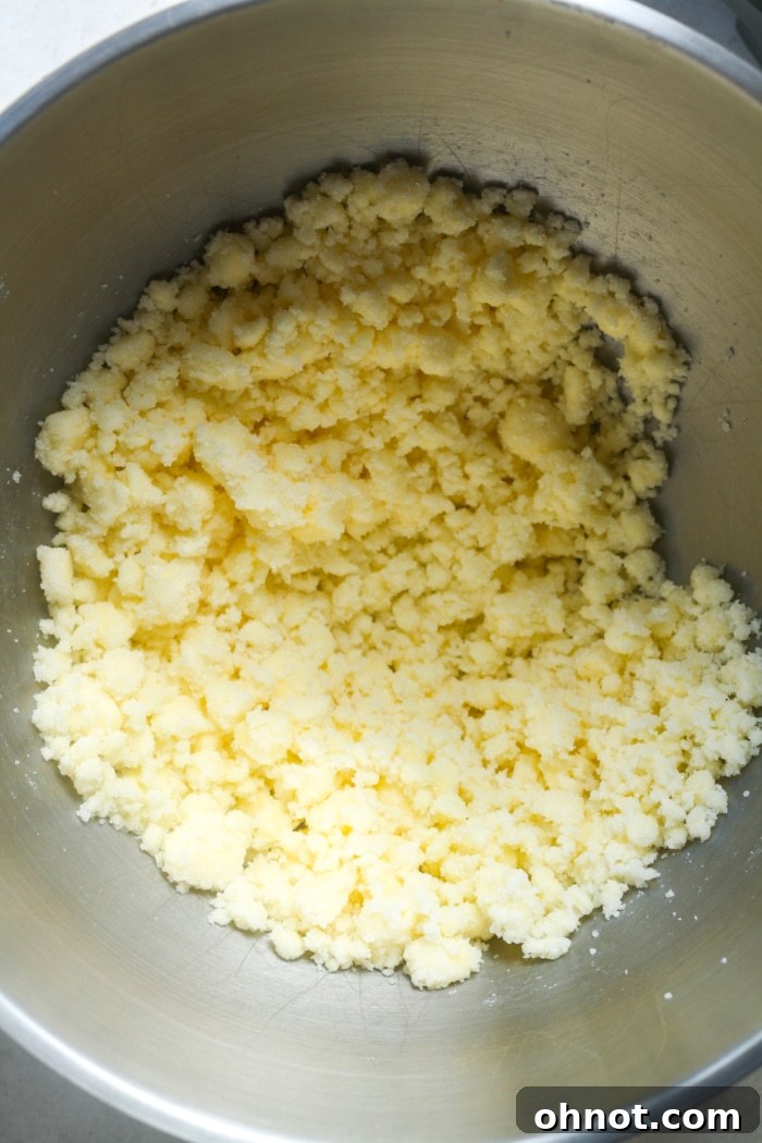 Creamy, beaten butter and sugar mixture in a mixing bowl.