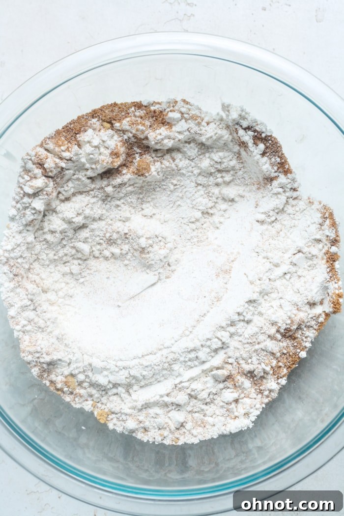 Gluten-free flour and coconut sugar in a mixing bowl, ready for combining.