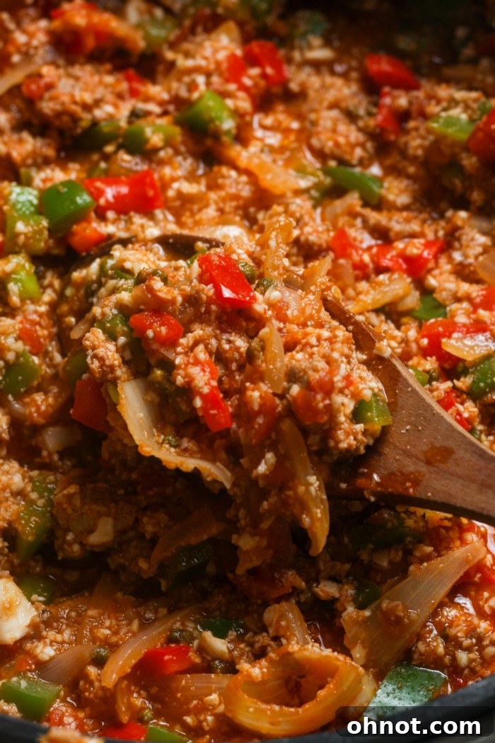 A close-up of the finished deconstructed stuffed peppers dish, ready to be served directly from the skillet.