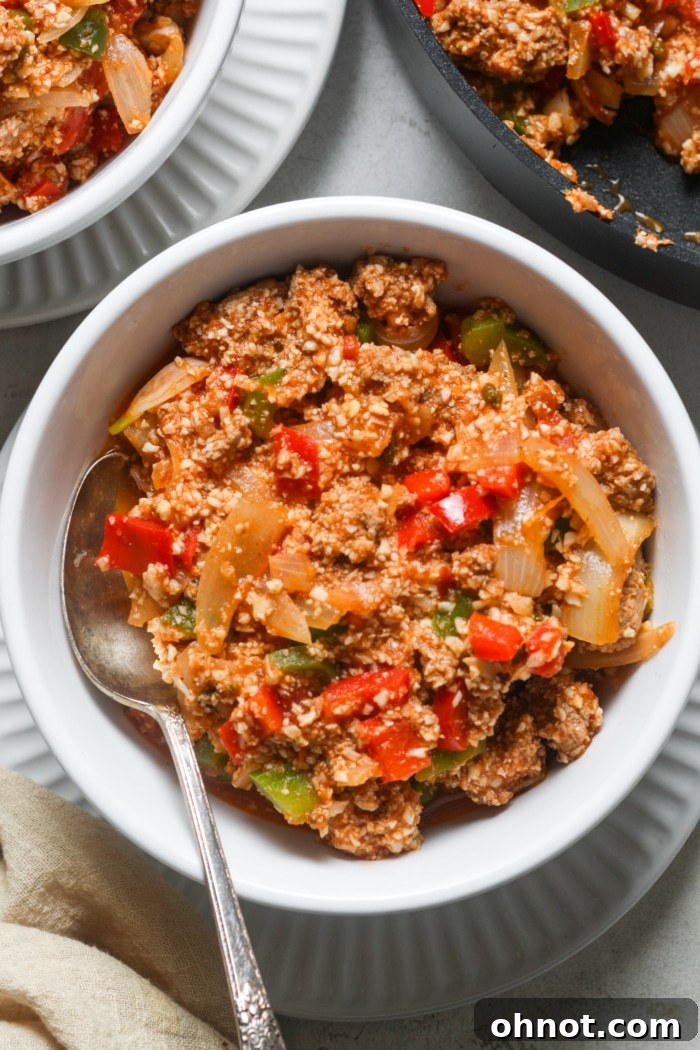 A perfectly portioned bowl of Deconstructed Stuffed Peppers, garnished and ready to eat.