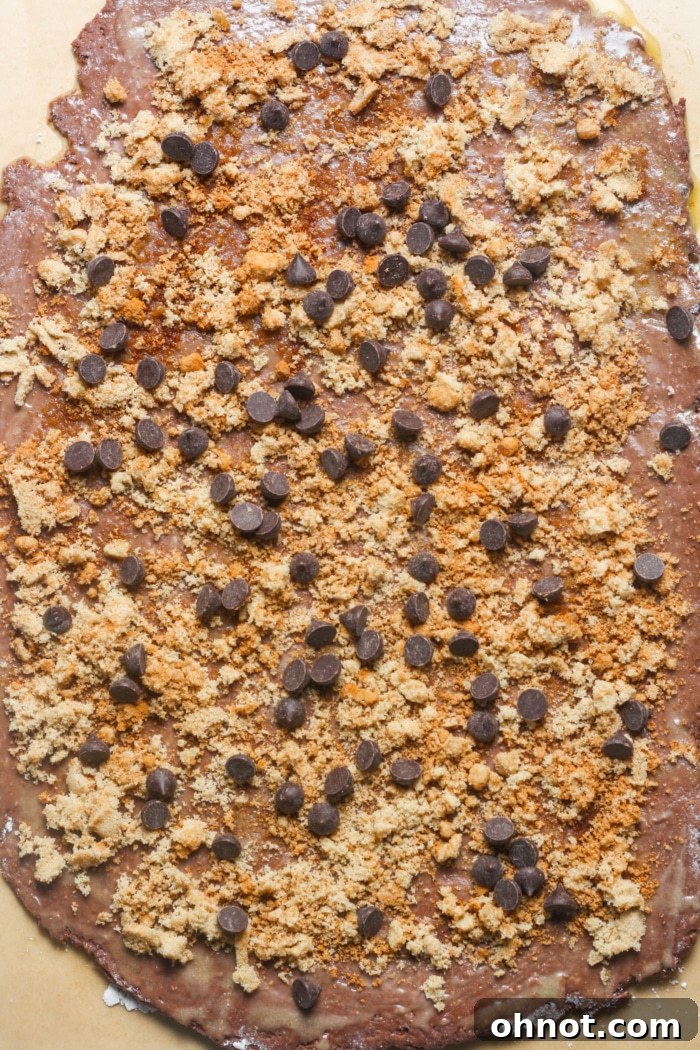 Chocolate chips and brown sugar cinnamon mixture spread on rolled dough.