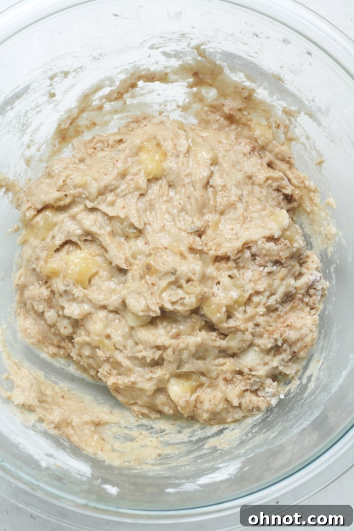 Thick banana bread batter after dry ingredients are mixed in.