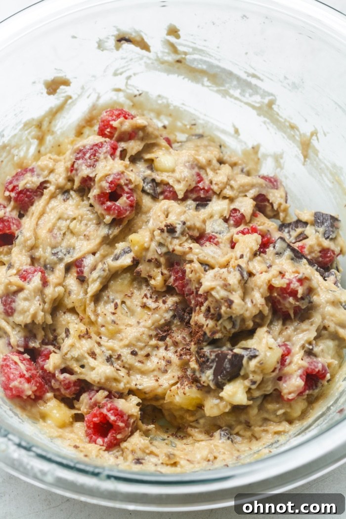 Bread batter gently mixed with fresh raspberries and dark chocolate chunks.