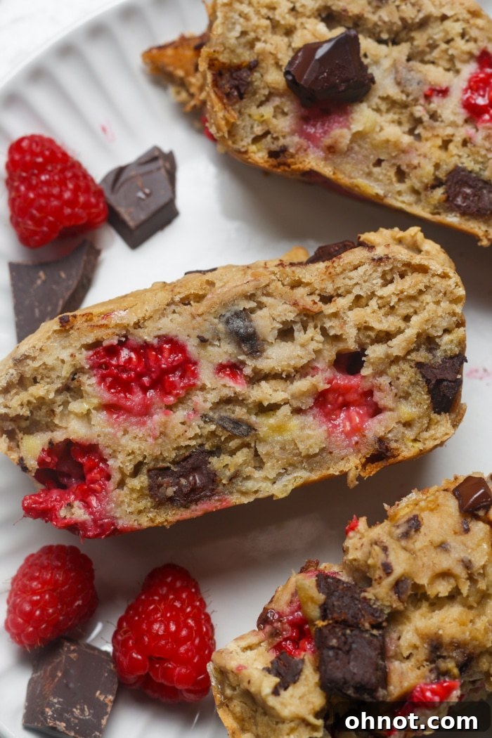 A beautiful loaf of chocolate raspberry bread, golden-brown and ready to be served.