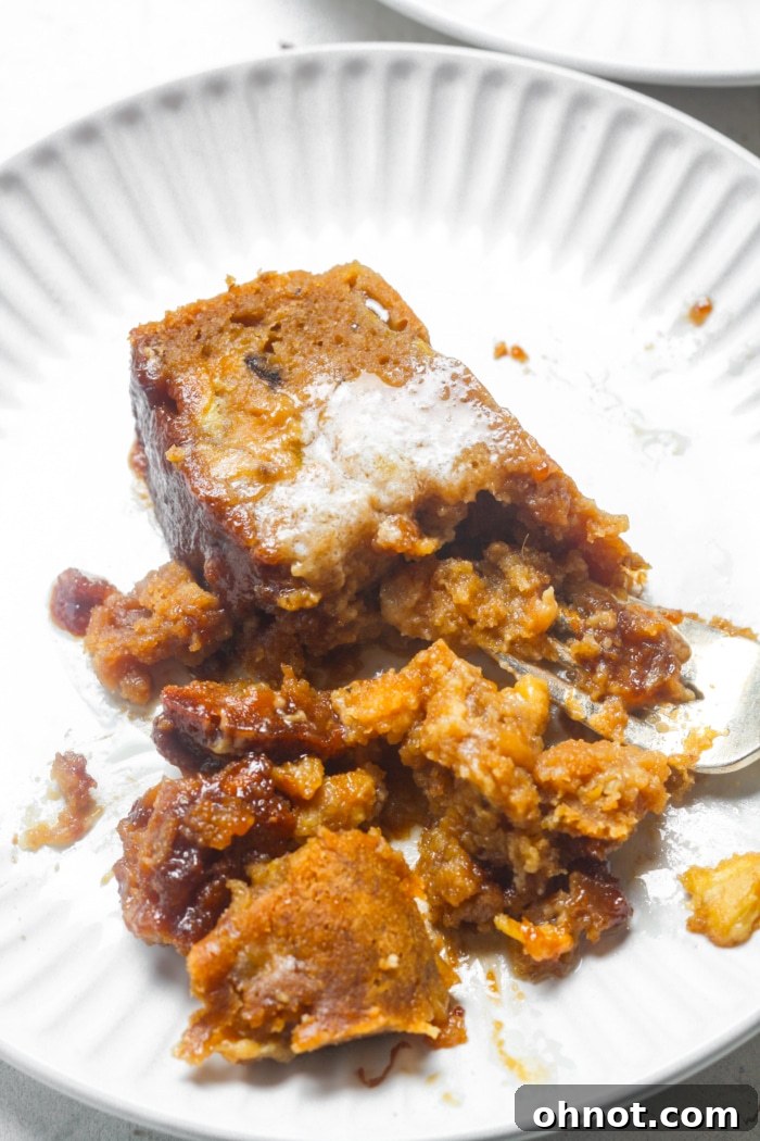 A delicious bite of cinnamon crunch banana bread with butter.