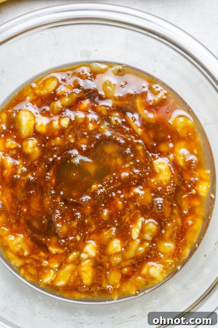 Thick, gooey mixture of wet ingredients in a bowl, perfectly blended.