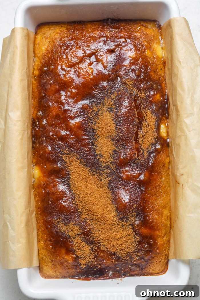 Baked cinnamon crunch banana bread with a golden, crunchy topping.