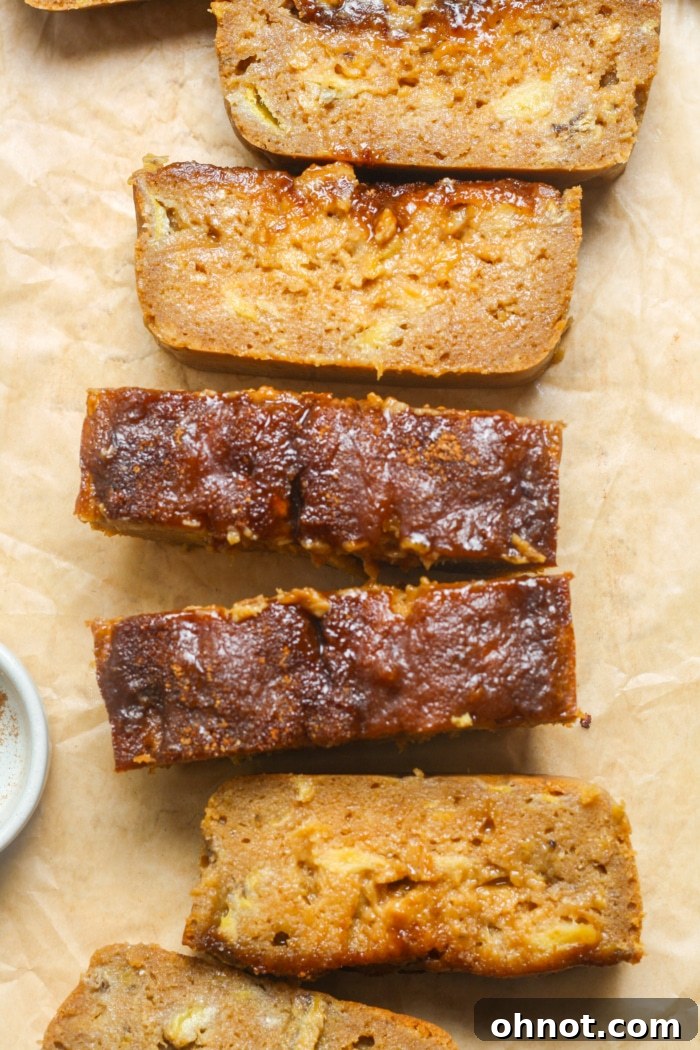 Perfectly sliced cinnamon crunch banana bread revealing a moist interior.