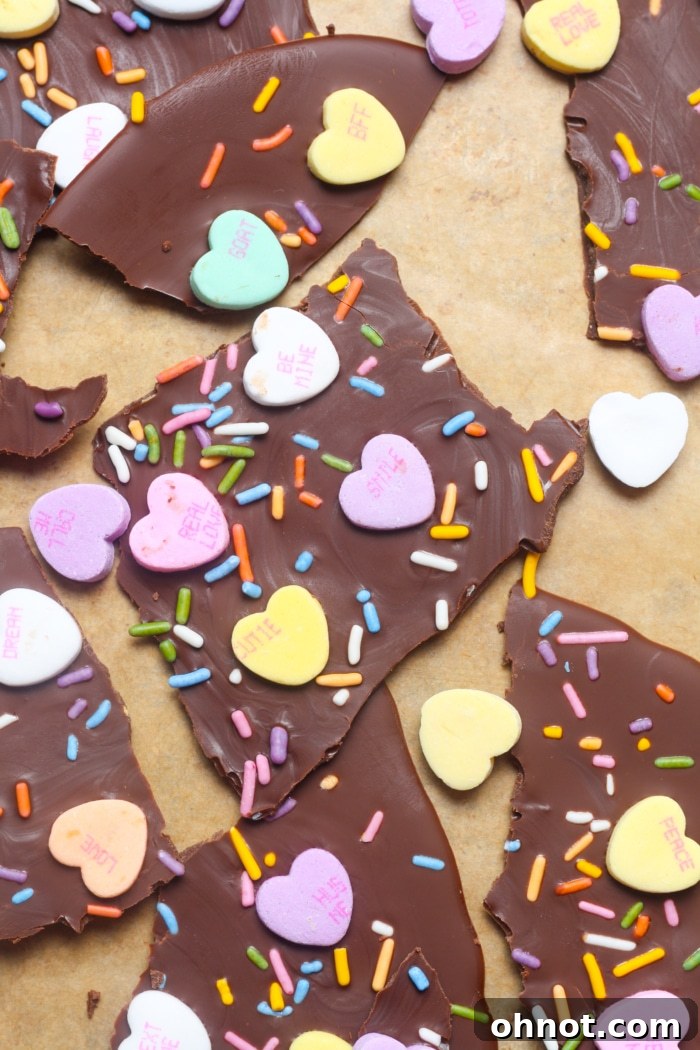 Delicious bites of Valentine's bark, showcasing the rich chocolate and colorful candy heart toppings, perfect for sharing.