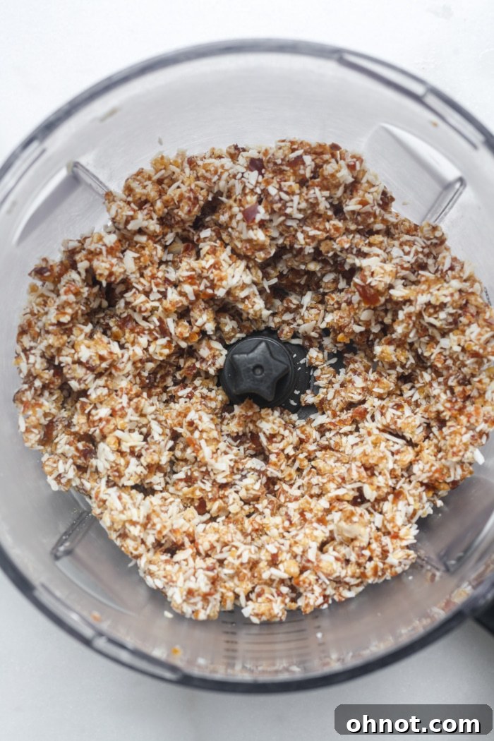 Dates and coconut flakes blended in a food processor.