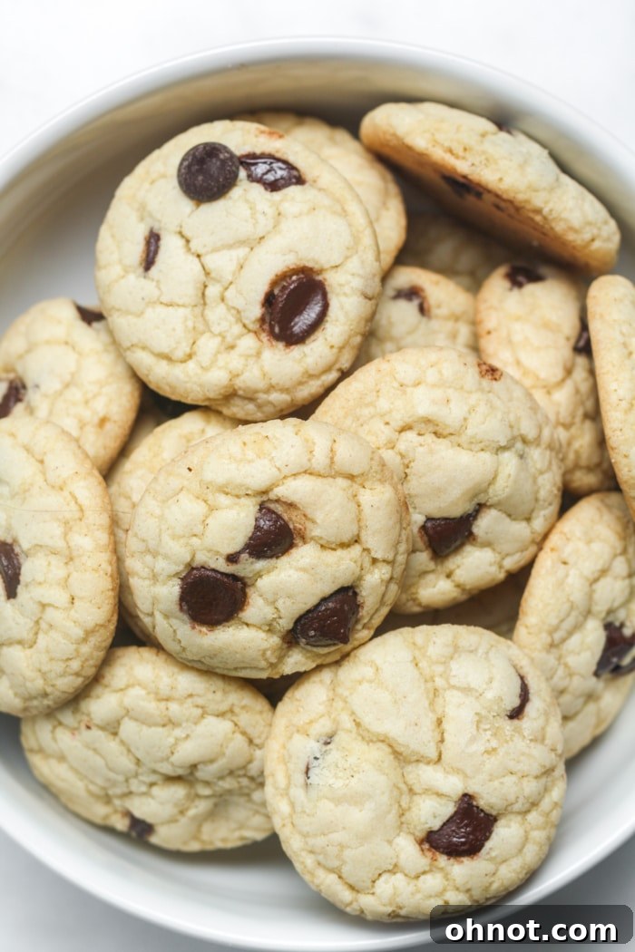 A stack of golden brown mini chocolate chip cookies.
