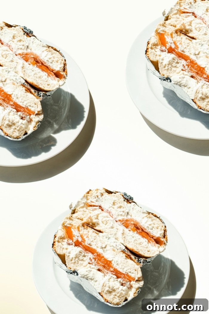 A tub of creamy vegan cream cheese spread on a wooden board, ready to be enjoyed with crackers or a bagel.