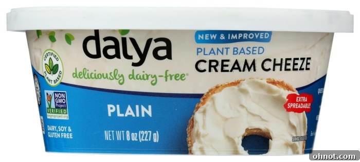 A tub of Daiya dairy-free cream cheese style spread, highlighting its plant-based nature and smooth texture.