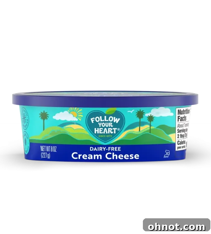 A package of Follow Your Heart dairy-free cream cheese, featuring a vibrant label and suggesting its creamy texture.