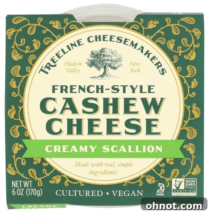 A tub of Treeline cashew-based vegan cream cheese, showcasing its natural and artisanal appearance.