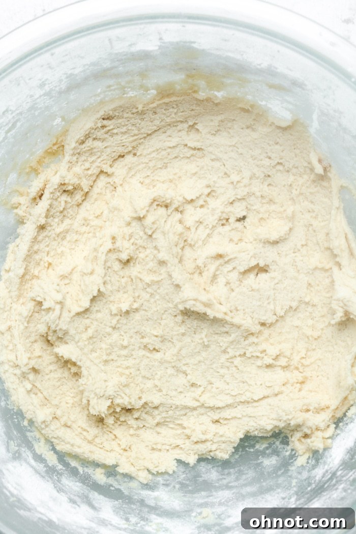 Cookie batter in a bowl after dry ingredients are mixed in, ready for marshmallows.