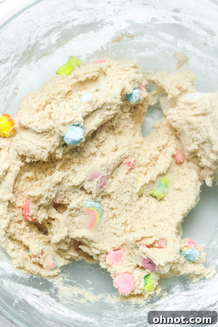 Cookie dough with colorful Lucky Charms marshmallows folded in.