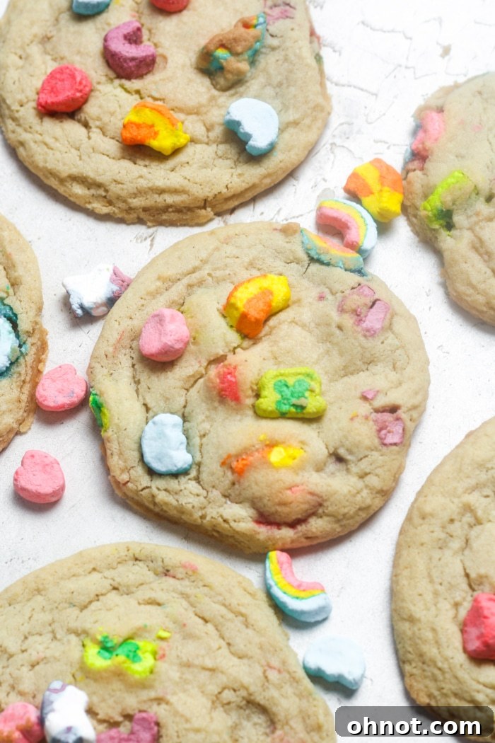 Close-up of baked Lucky Charms cookies, showing the texture and colorful marshmallows.