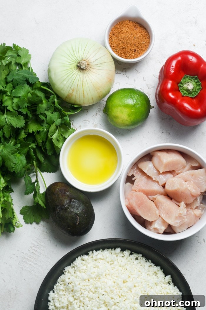 All the fresh ingredients laid out for making delicious chicken fajita bowls.