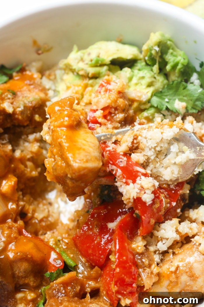 Cauliflower rice mixed with vibrant veggies, ready to be topped.
