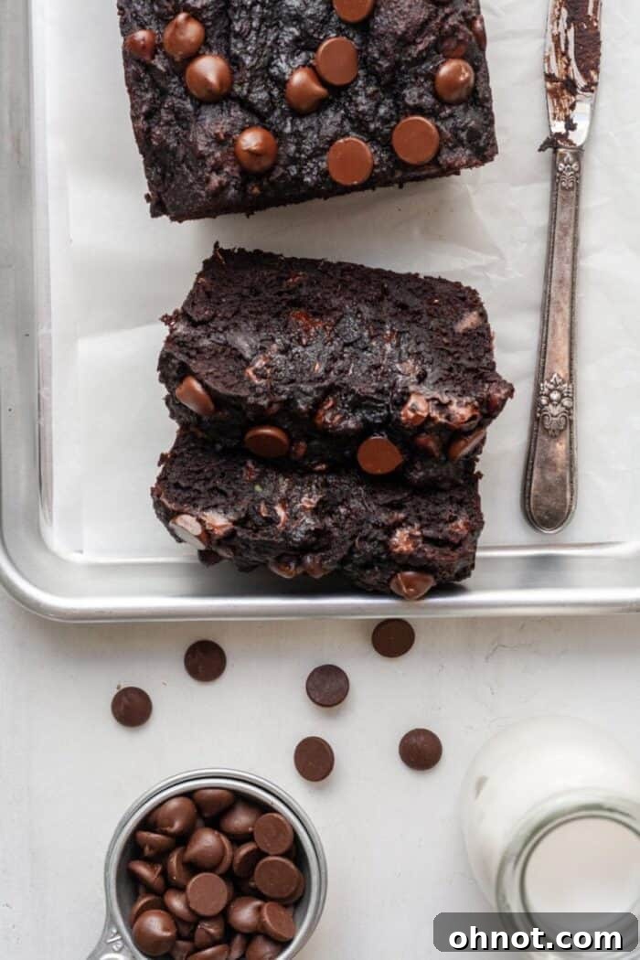 Gluten free chocolate zucchini bread slices on a wooden board