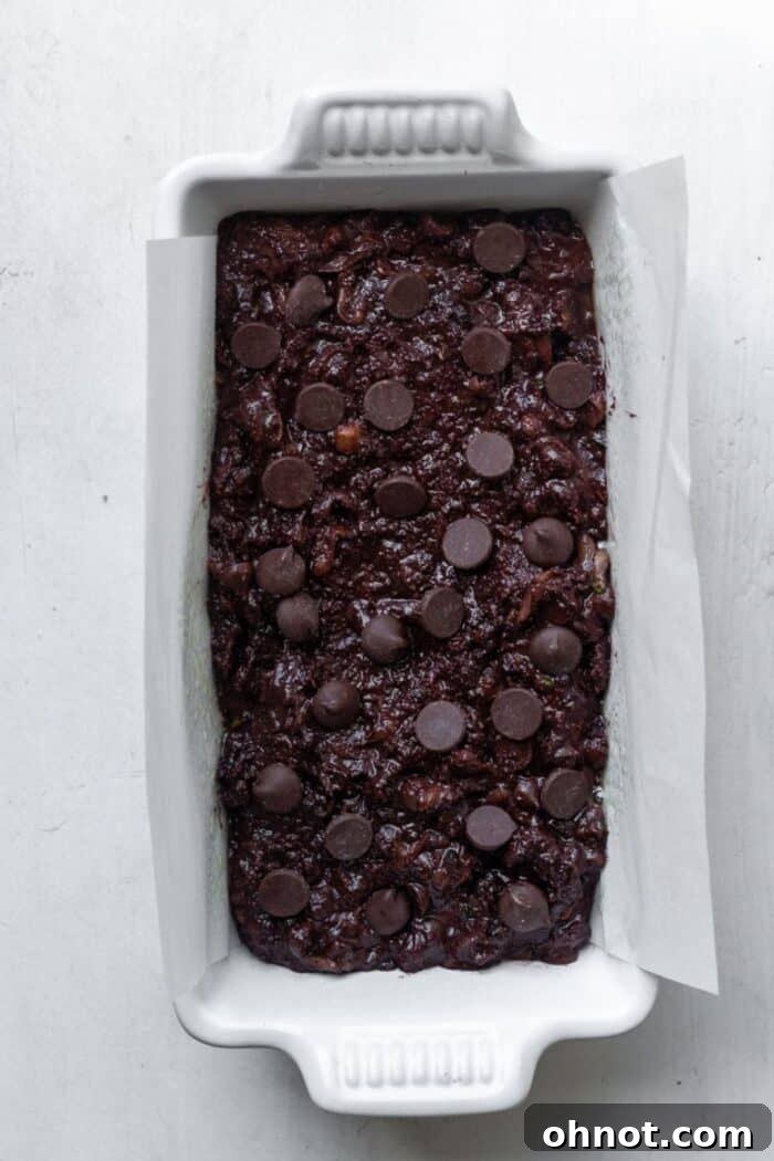 Chocolate zucchini bread batter in a loaf pan, ready for baking