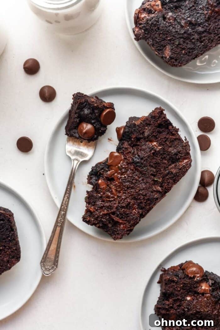 A delicious slice of gluten-free chocolate zucchini bread with a fork