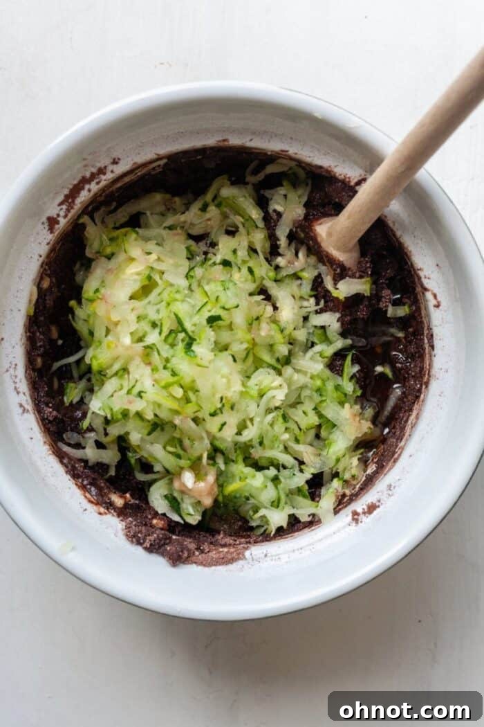 Zucchini bread batter with grated zucchini mixed in