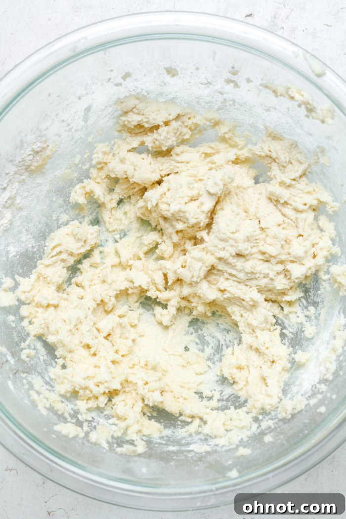 Thick, smooth white cookie dough ready for shaping.