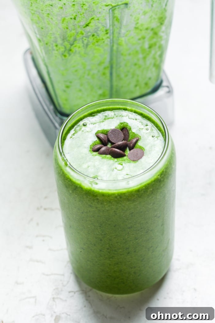 A refreshing shamrock smoothie in a tall glass, ready to be enjoyed.