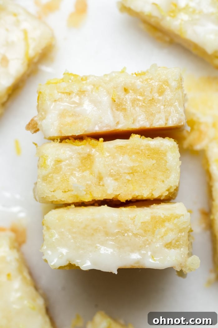 Fudgy Lemon Brownies topped with a vibrant lemon glaze, ready to be enjoyed.
