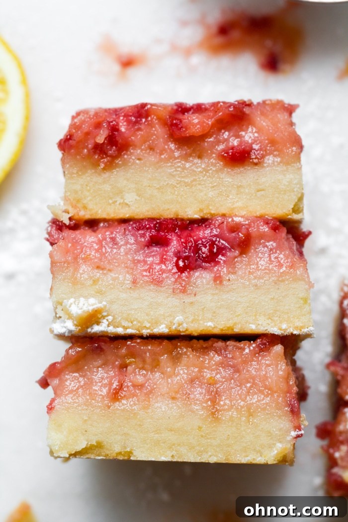 Lemon raspberry bars, beautifully cut and ready to serve.