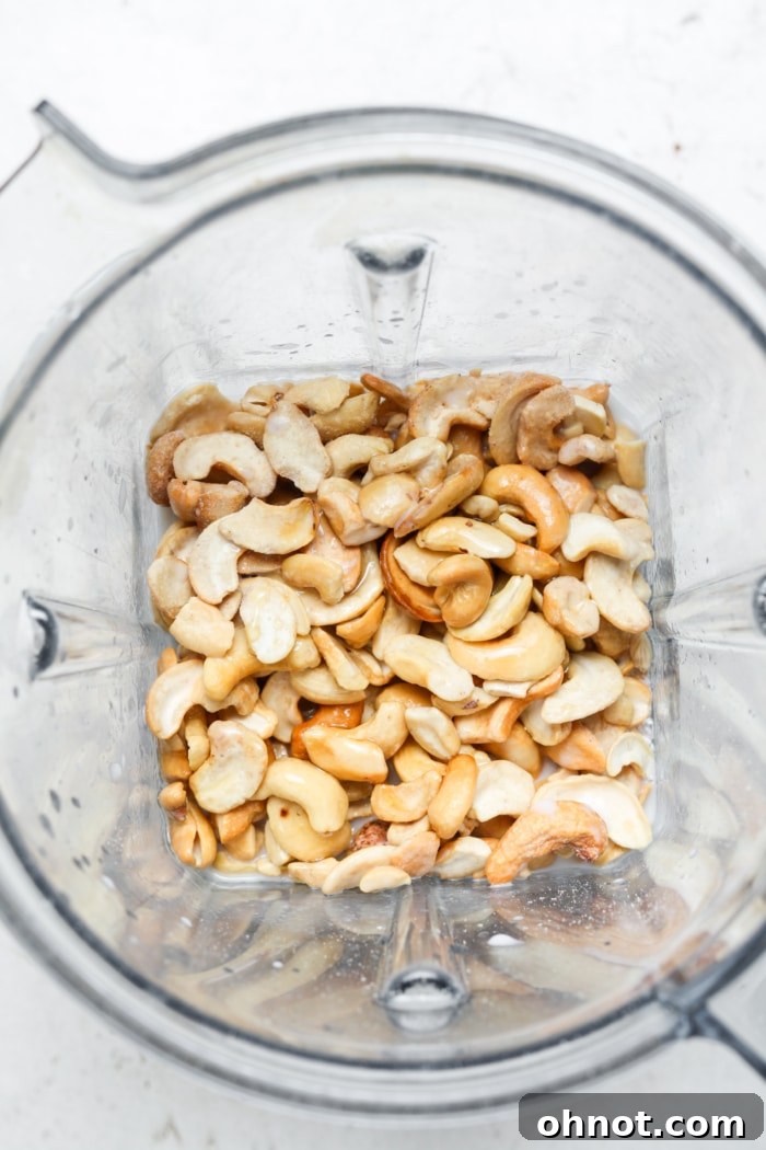 Soaked cashews in a blender, ready for making the creamy cheesecake filling.