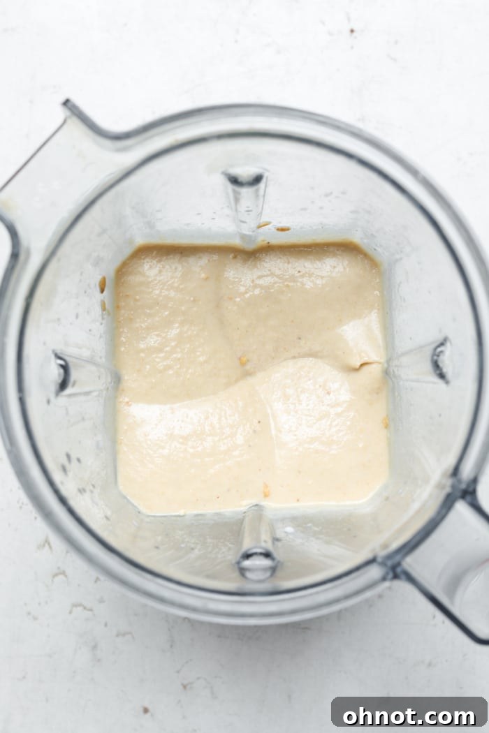 The smooth and creamy vegan cheesecake mixture in a blender.