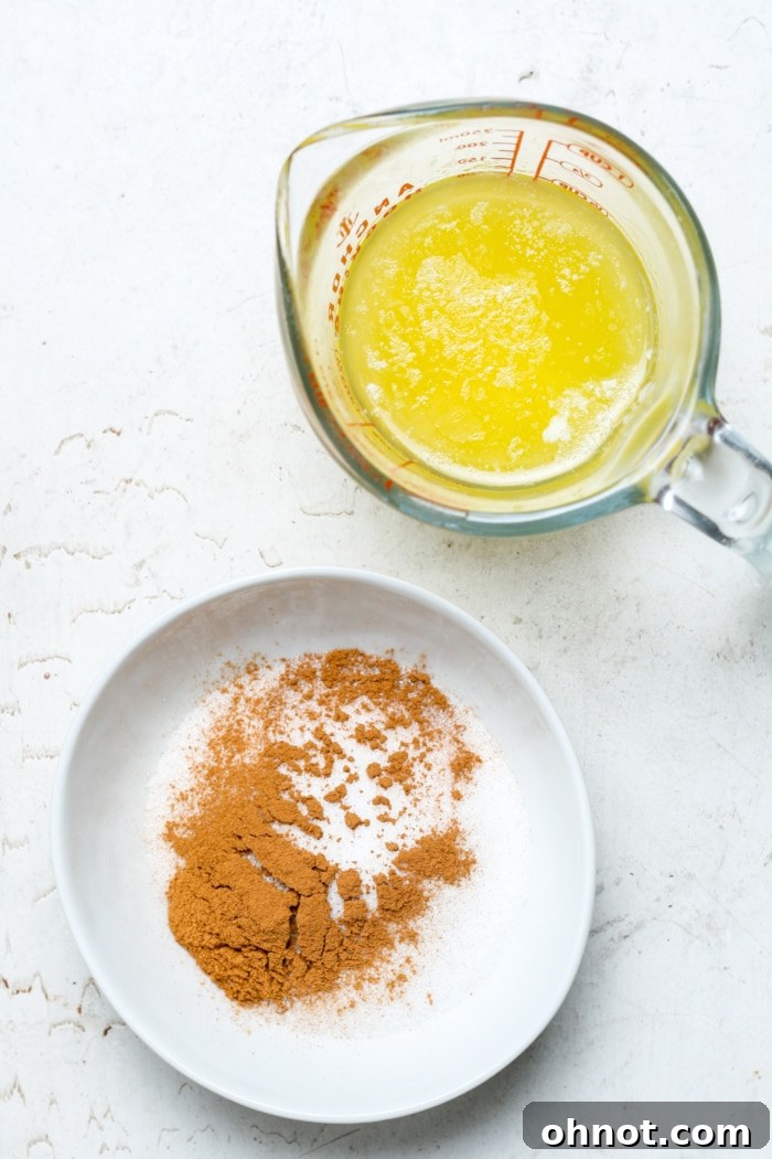 Separate bowls containing melted butter and cinnamon sugar mixture.