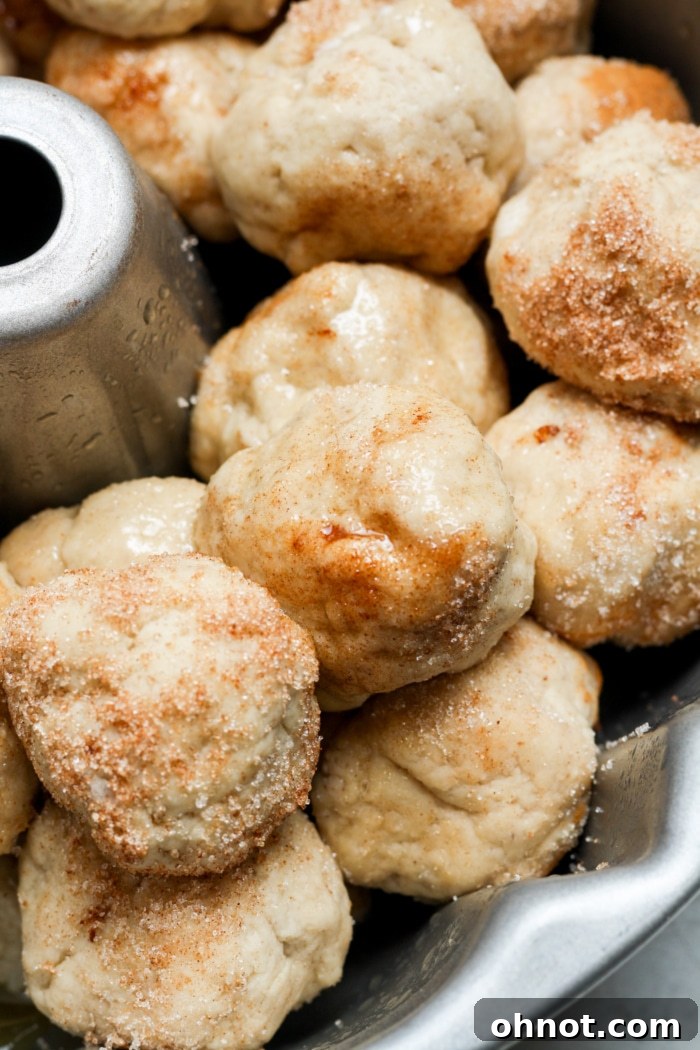 Assembled monkey bread dough balls in a Bundt pan, ready for baking.