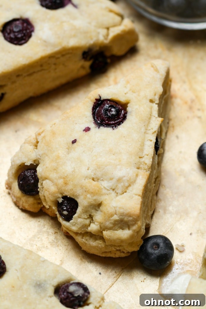 Gluten free scones, golden brown with blueberries visible.