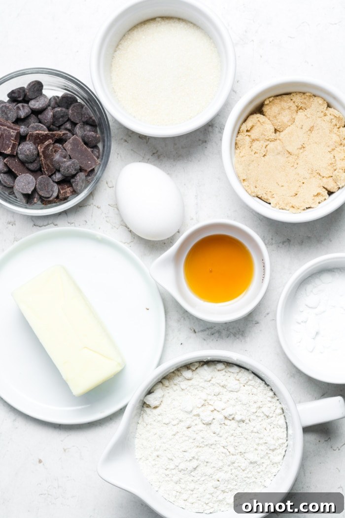 Various ingredients laid out on a kitchen counter, ready for making brown butter chocolate chip cookie bars.