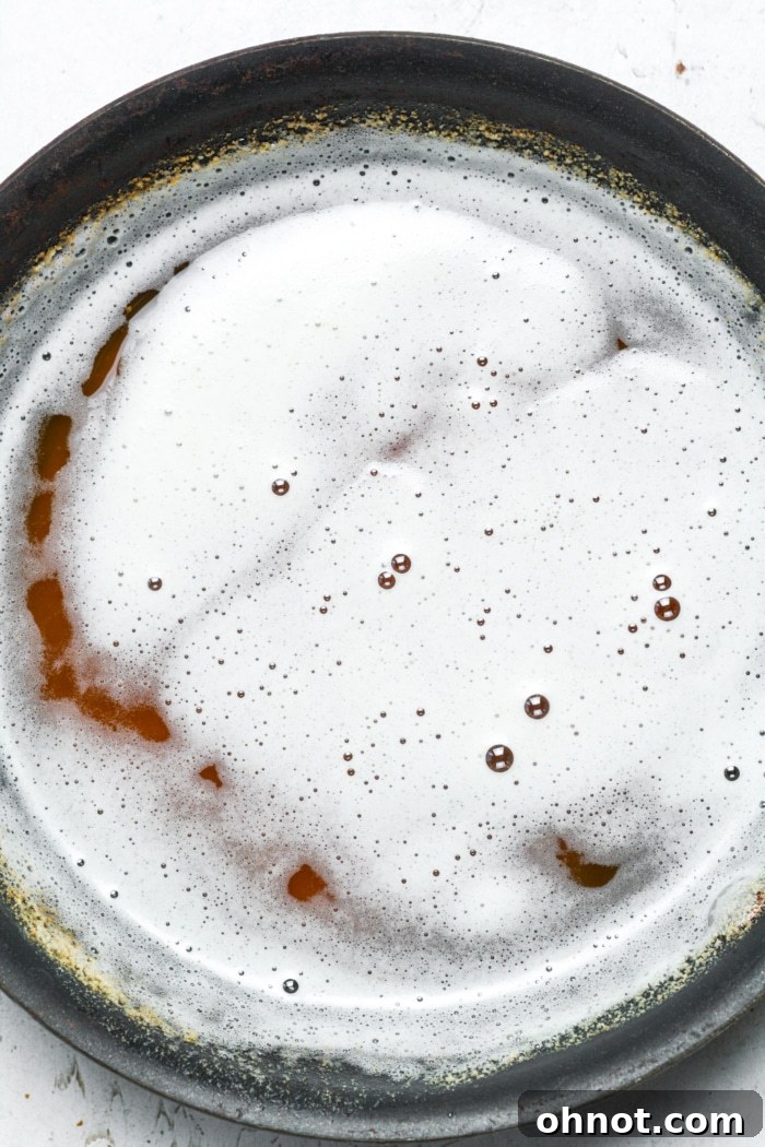 Butter browning in a skillet on the stovetop, turning golden and fragrant.