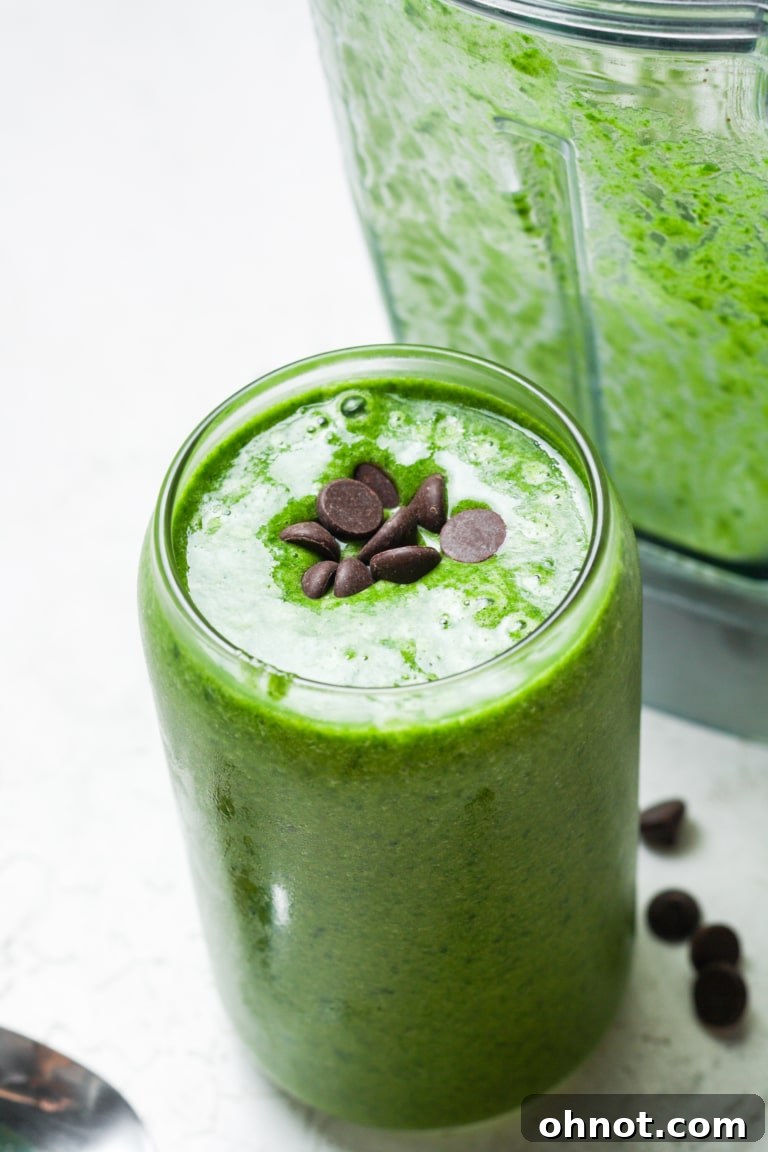 Homemade high-protein shamrock shake with whipped cream and cherry